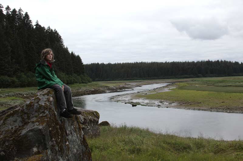 Zac on a rock overlooking the Savage River in Denali