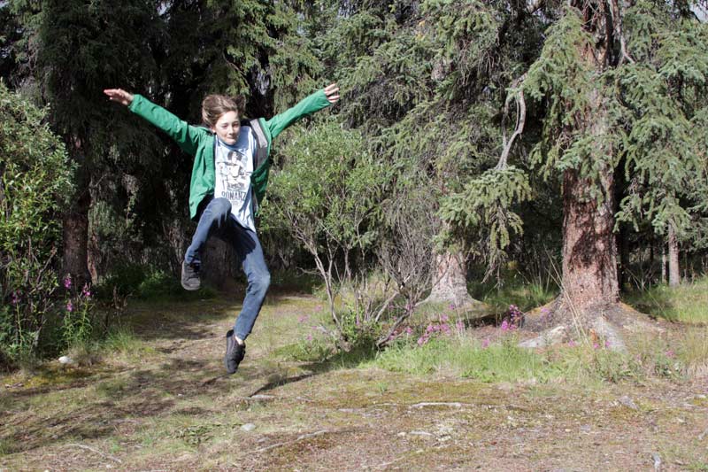 Zac leaps in the woods behind our RV
