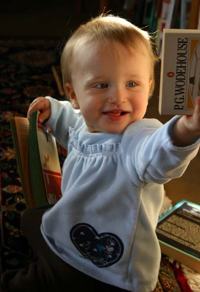 Lucy reaches for a book