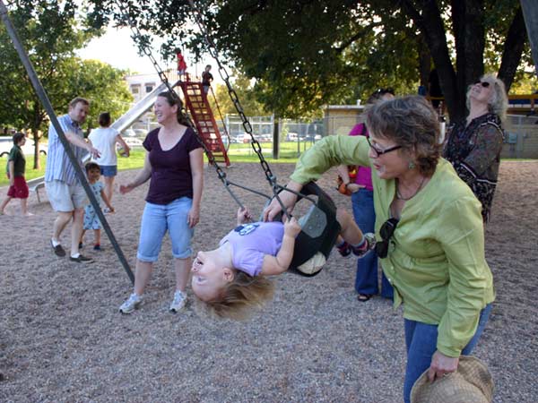 Lucy trapezing on the swing