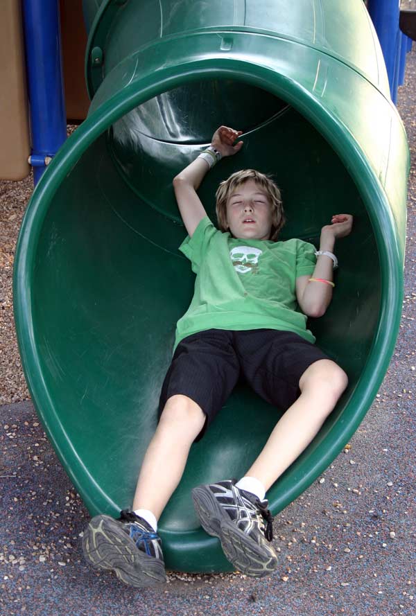 Zac relaxes on the slide