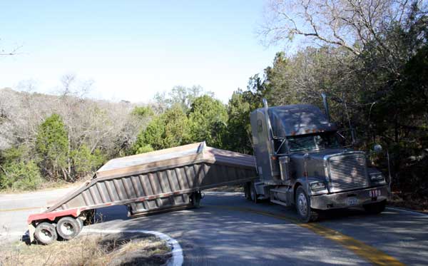 Jackknifed truck east of the Pedernales River on Hamilton Pool Road