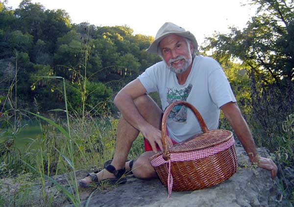 Ric on rock with basket.