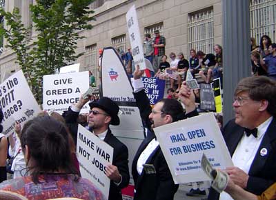 Billionaires for Bush demonstrate in tuxedos and evening gowns