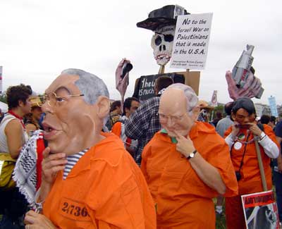 Colin Powell, Dick Cheney and Condoleeza Rice in prison jumpsuits.