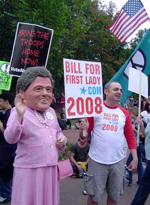 Woman with a Bill Clinton head. Sign says "Bill for First Lady"